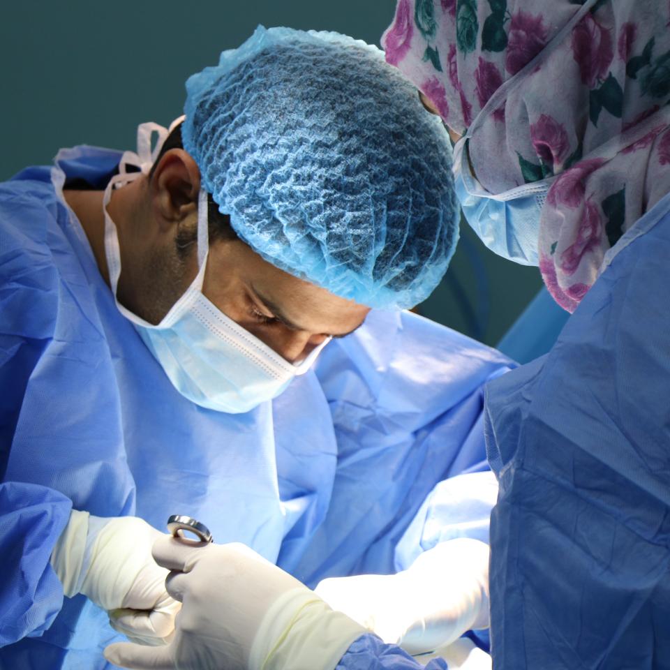 Two surgeons undertaking an operation