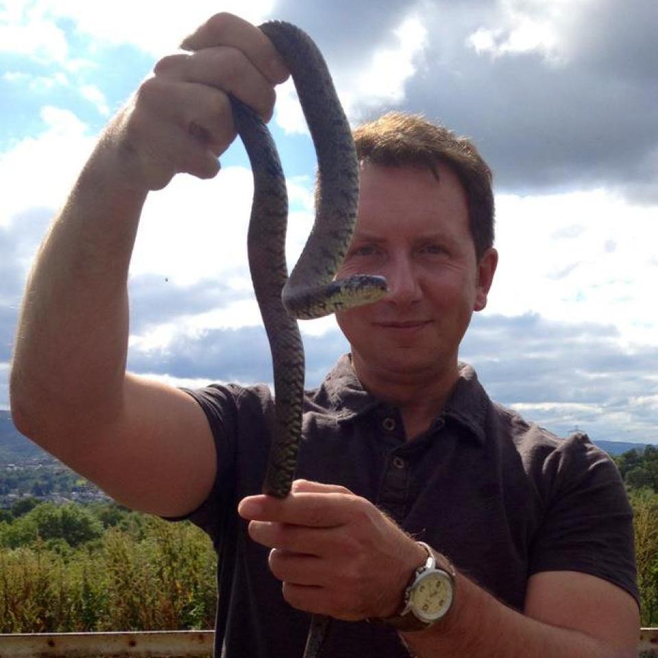 Rhys Jones holding up a snake