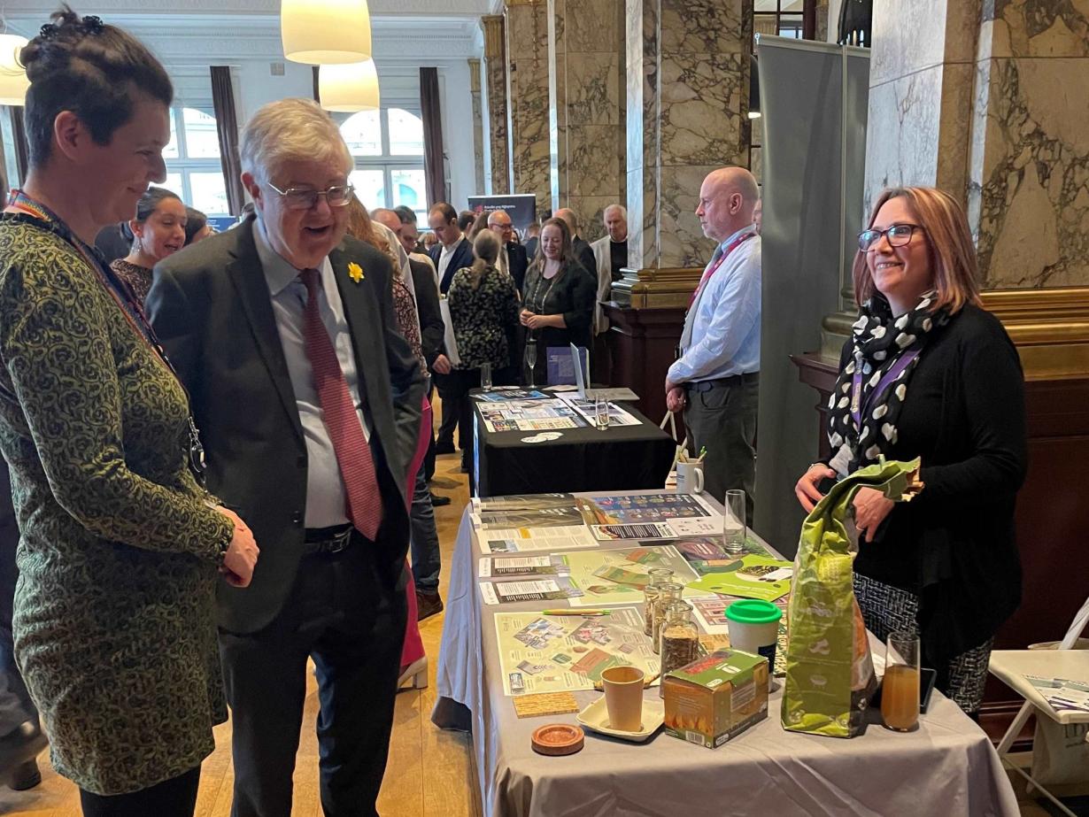 Mark Drakeford and the miscanthus grass exhibit at Brussels event