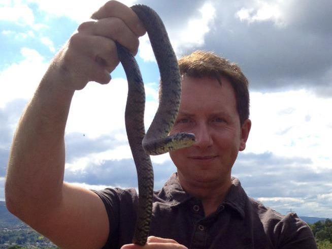 Rhys Jones holding a snake