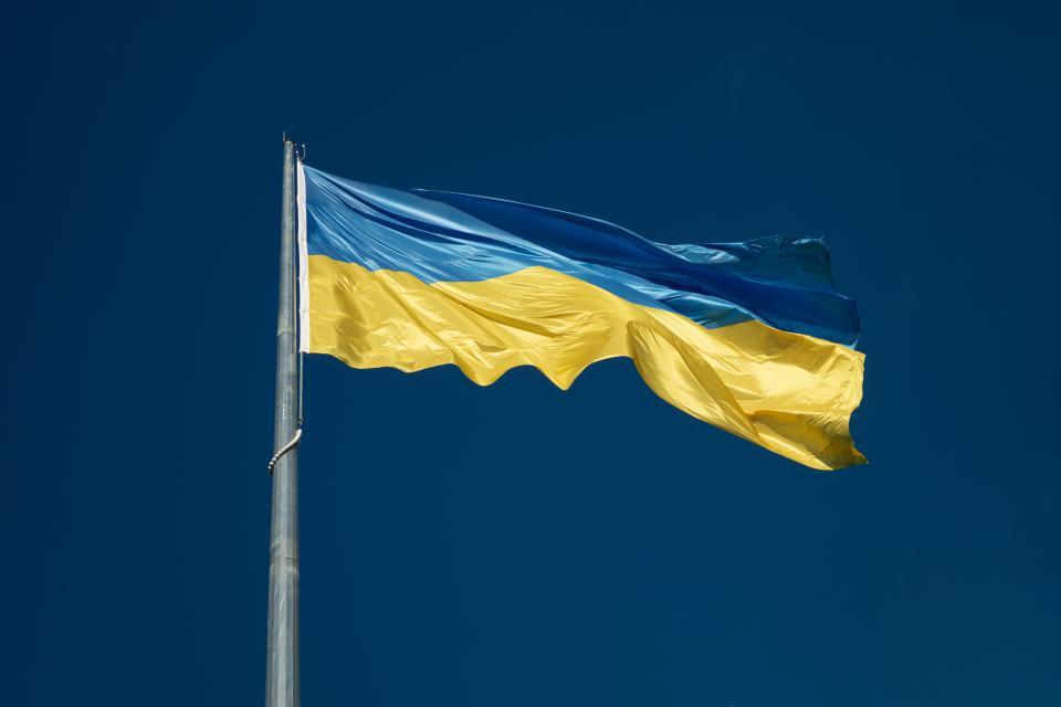 Ukraine flag against blue sky