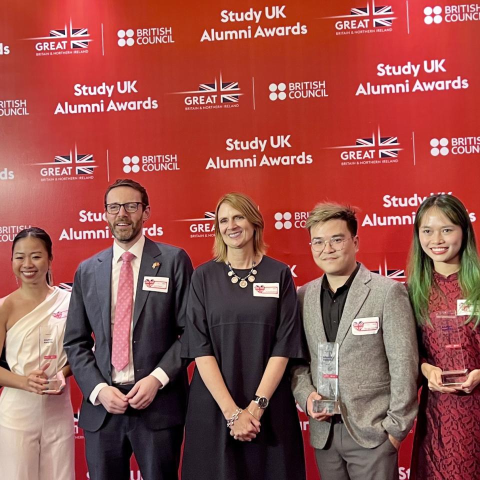 StudyUK Alumni award winners holding their awards. 