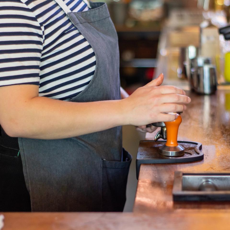 Person working in a coffee shop