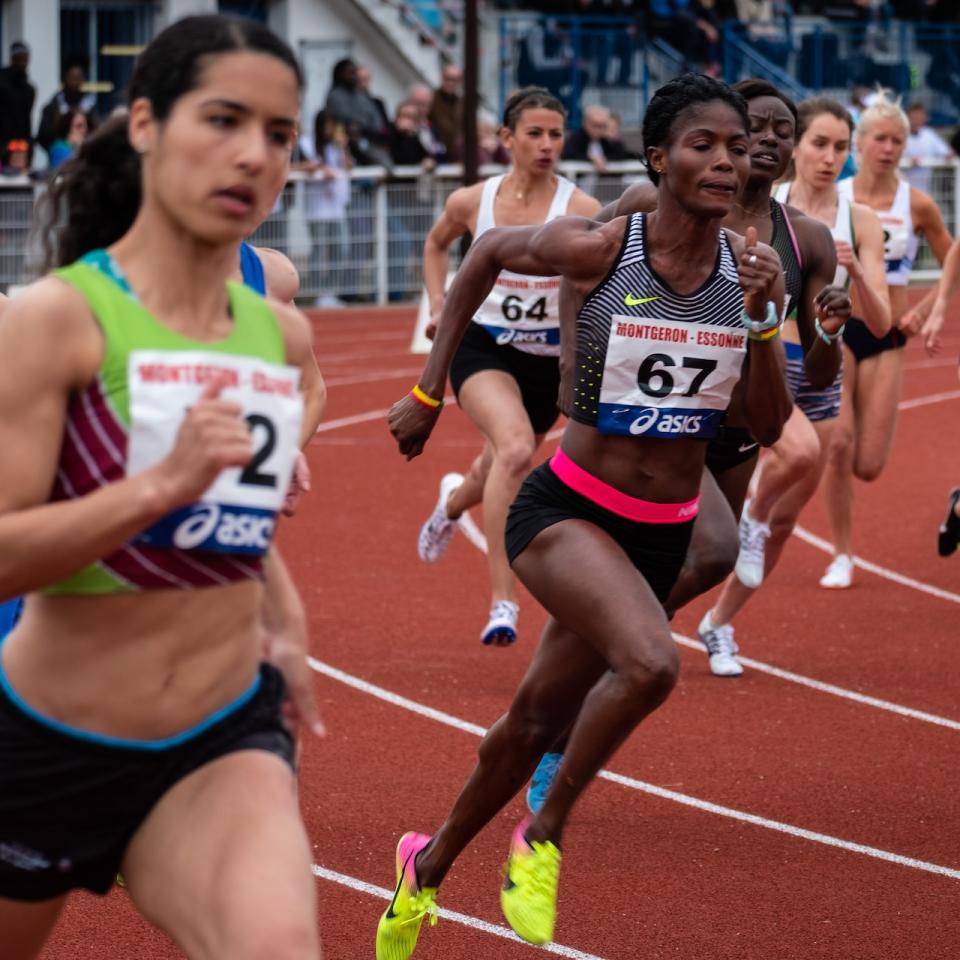 Female runners racing on a track