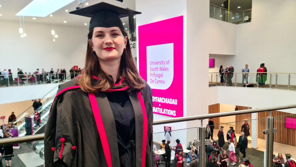 Photo of Antigone in graduation cap and gown