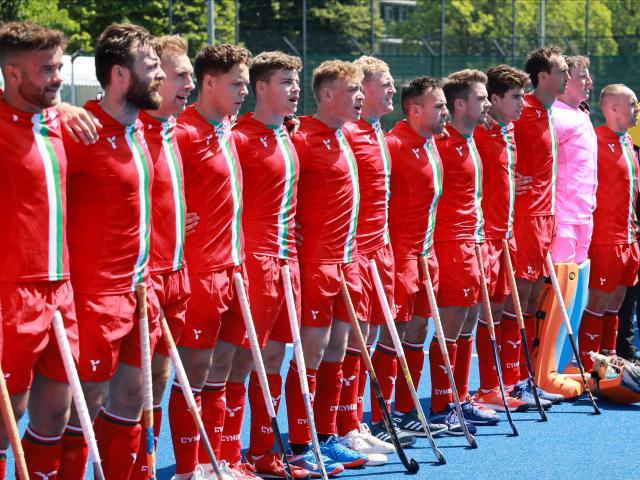 Wales men's hockey team lining up before a match. 