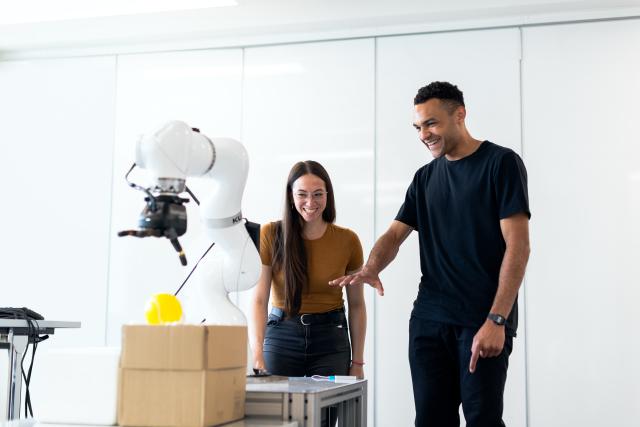 A woman and man using robotic technology