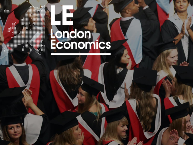 A group of smiling people dressed in graduation caps and gowns