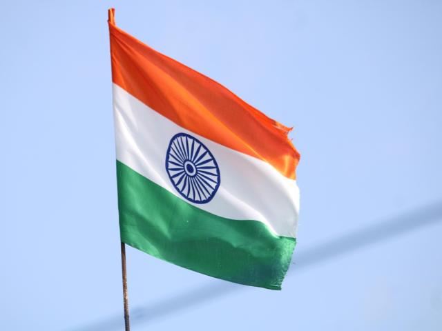 India flag against a blue sky